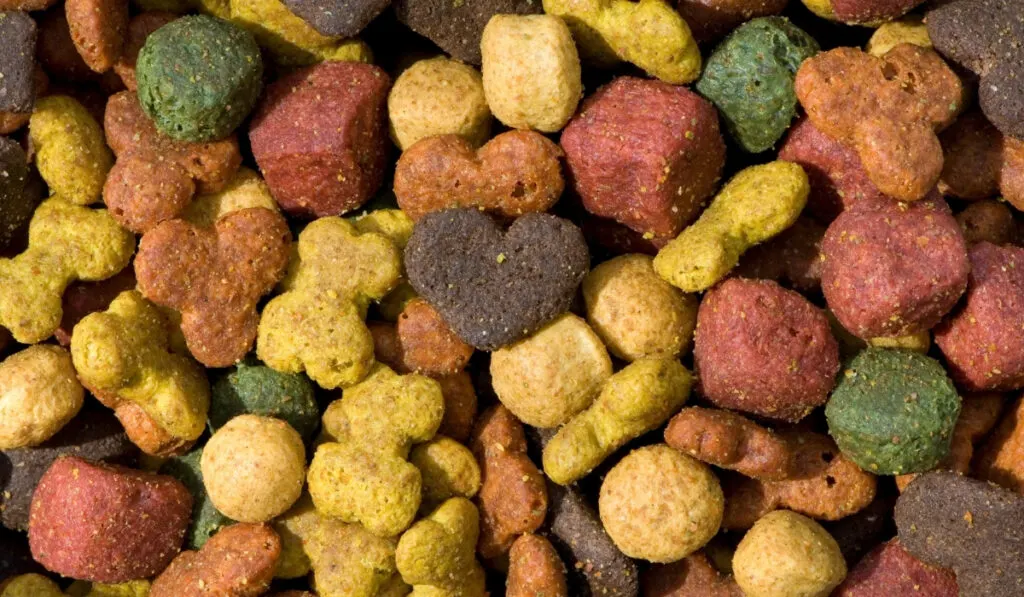 a pile of dog food in different colors and shapes