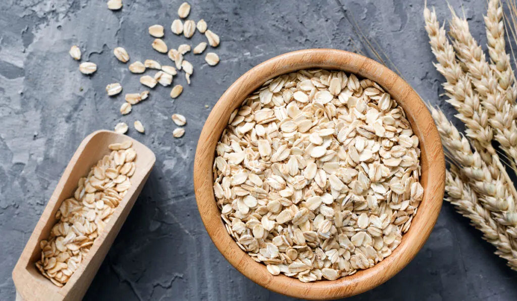 oats flakes wooden bowl