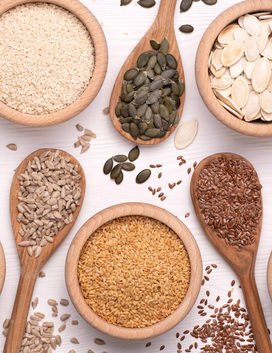 various-healthy-seeds-on-wooden-bowl-and-spoon