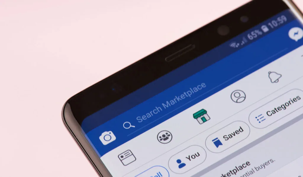 Facebook marketplace search bar on smartphone screen background, closeup view