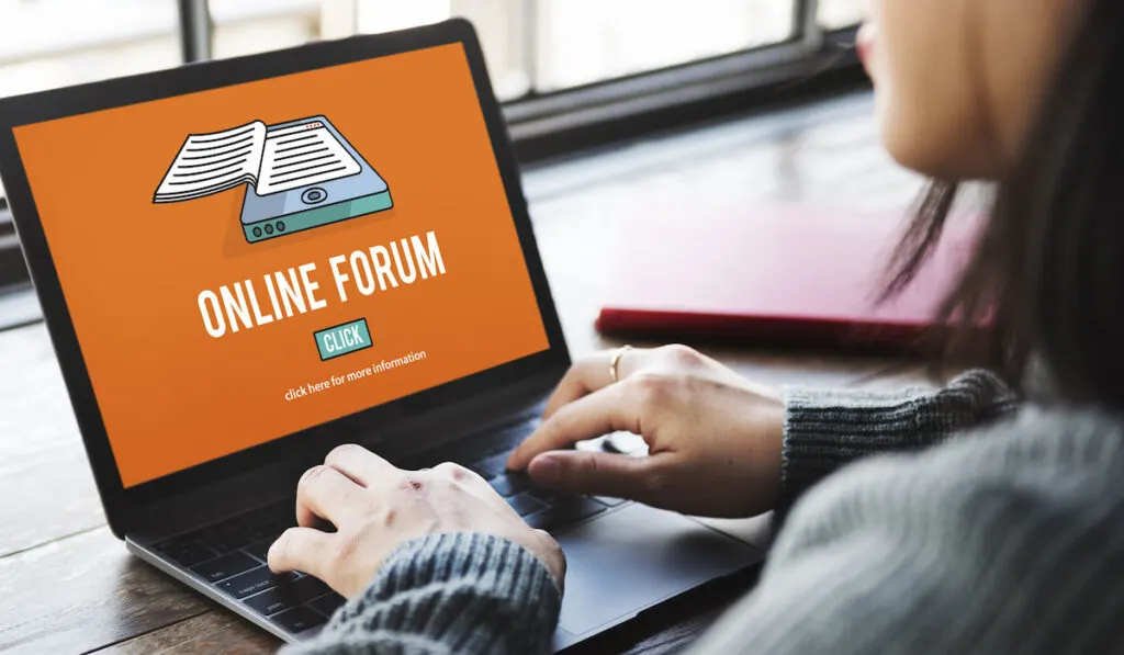 woman browsing on her laptop an online forum