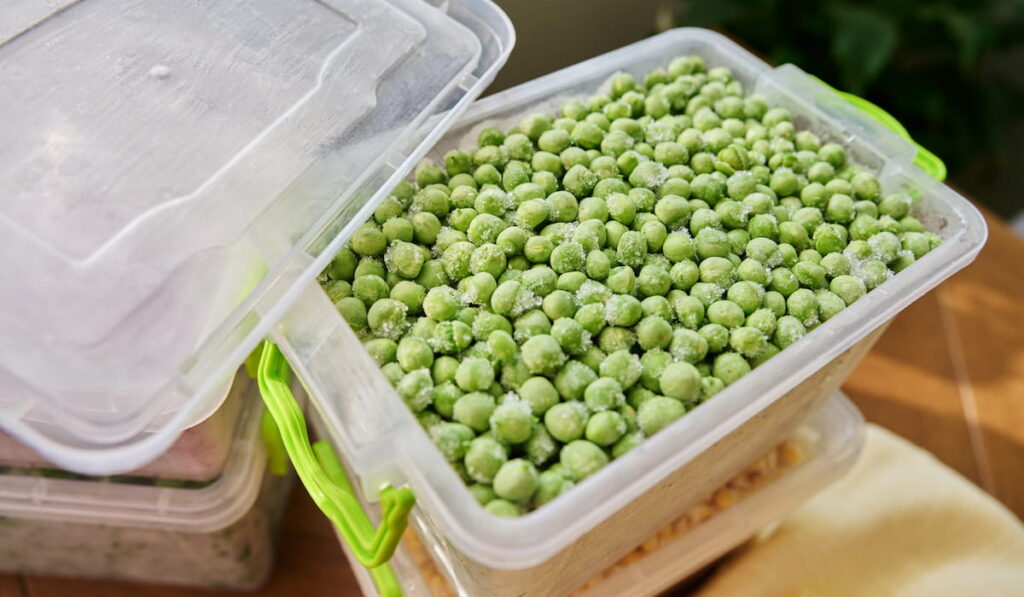 frozen green peas in a container