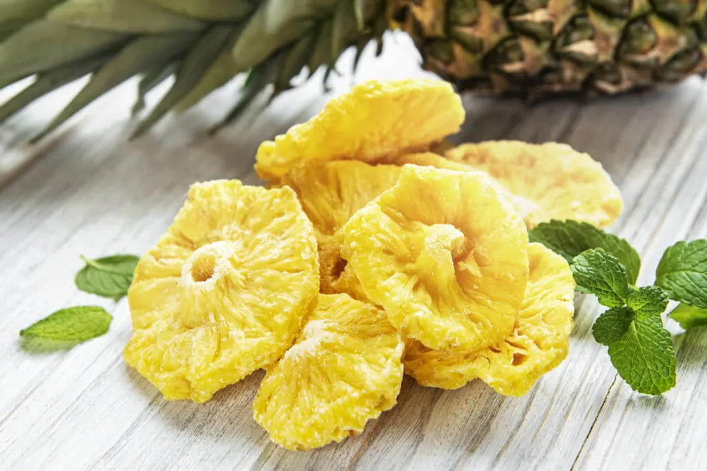 dried pineapples with fresh mint leaves on the table