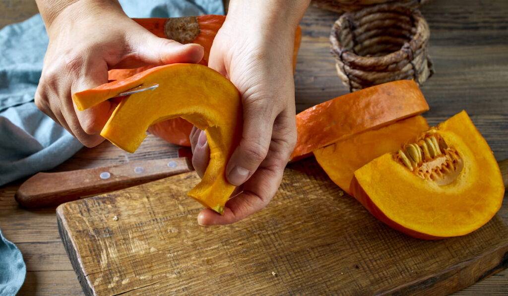 peeling fresh pumpkin 