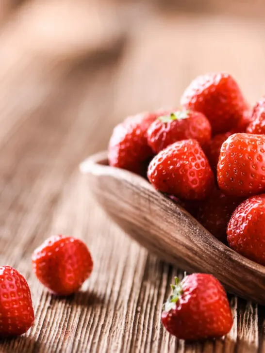 fresh strawberries on a wooden bowl