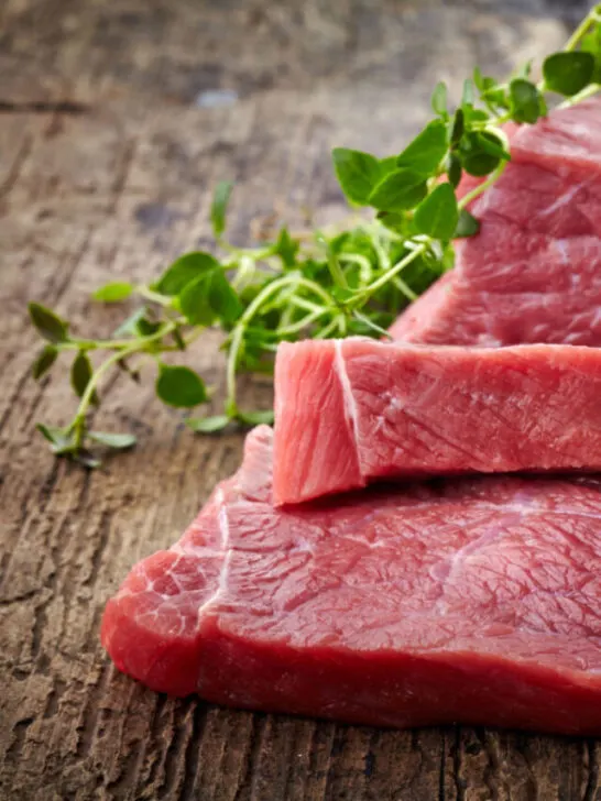 fresh raw meat on a wooden table