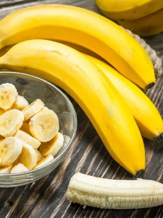 banana fruits and sliced banana in a glass bowl